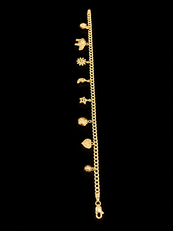 14k yellow gold charm bracelet with heart, elephant, sun and moon charms on black background — True Smith Jewelers Miami